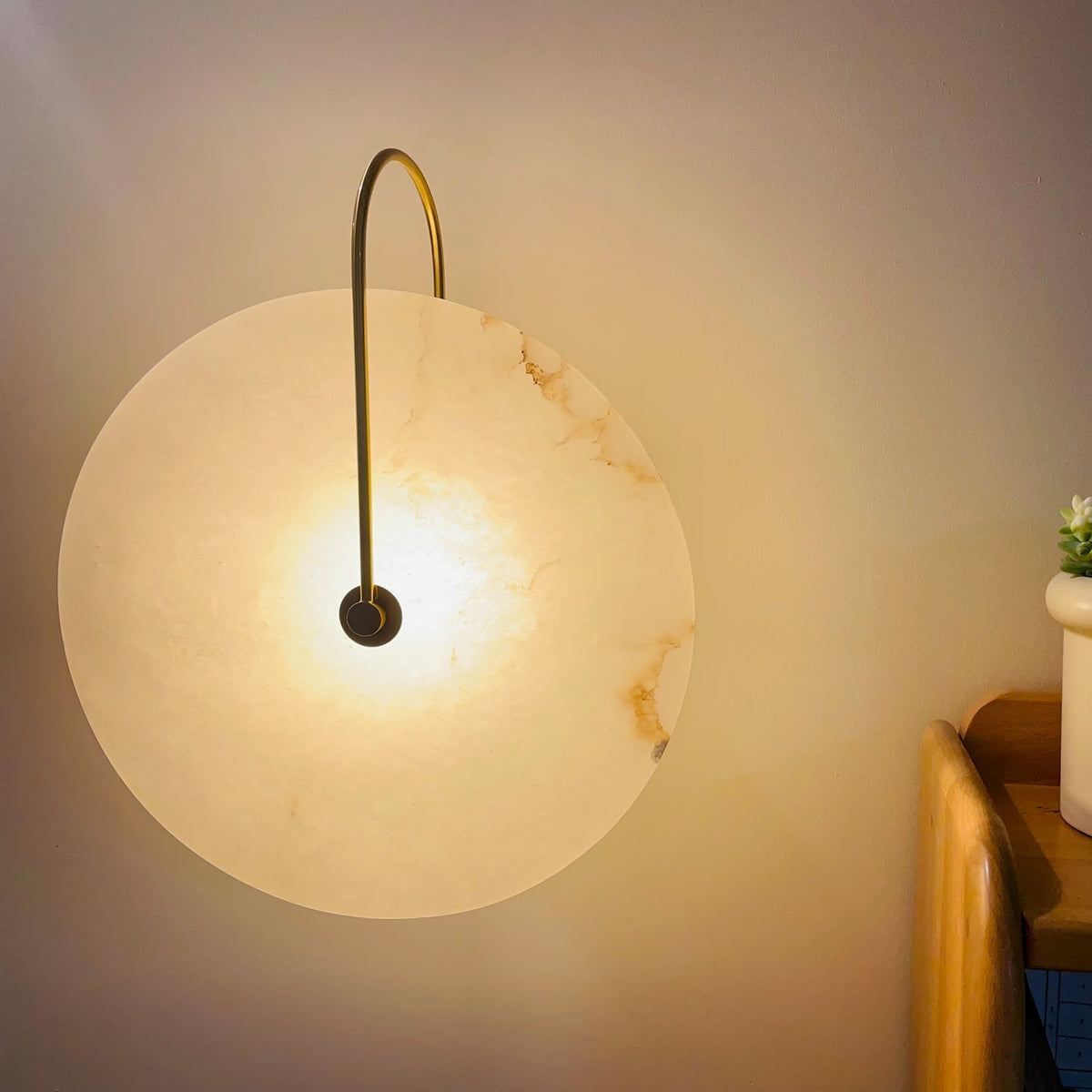 Alabaster LED Disc Wall Sconce — Warm Light, Black Arm