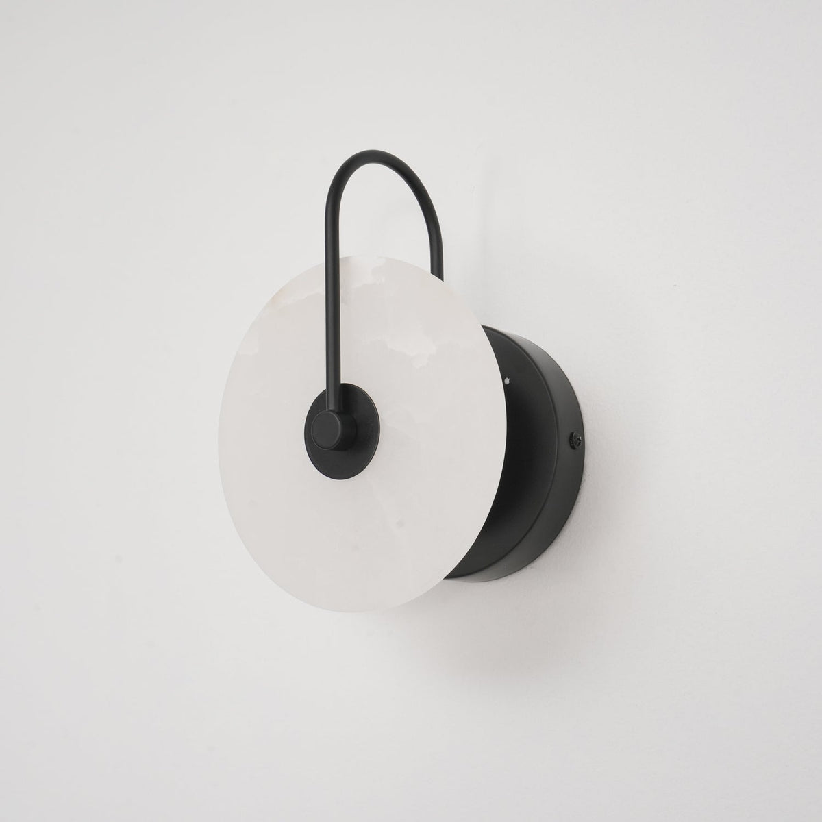 Alabaster LED Disc Wall Sconce — Warm Light, Black Arm