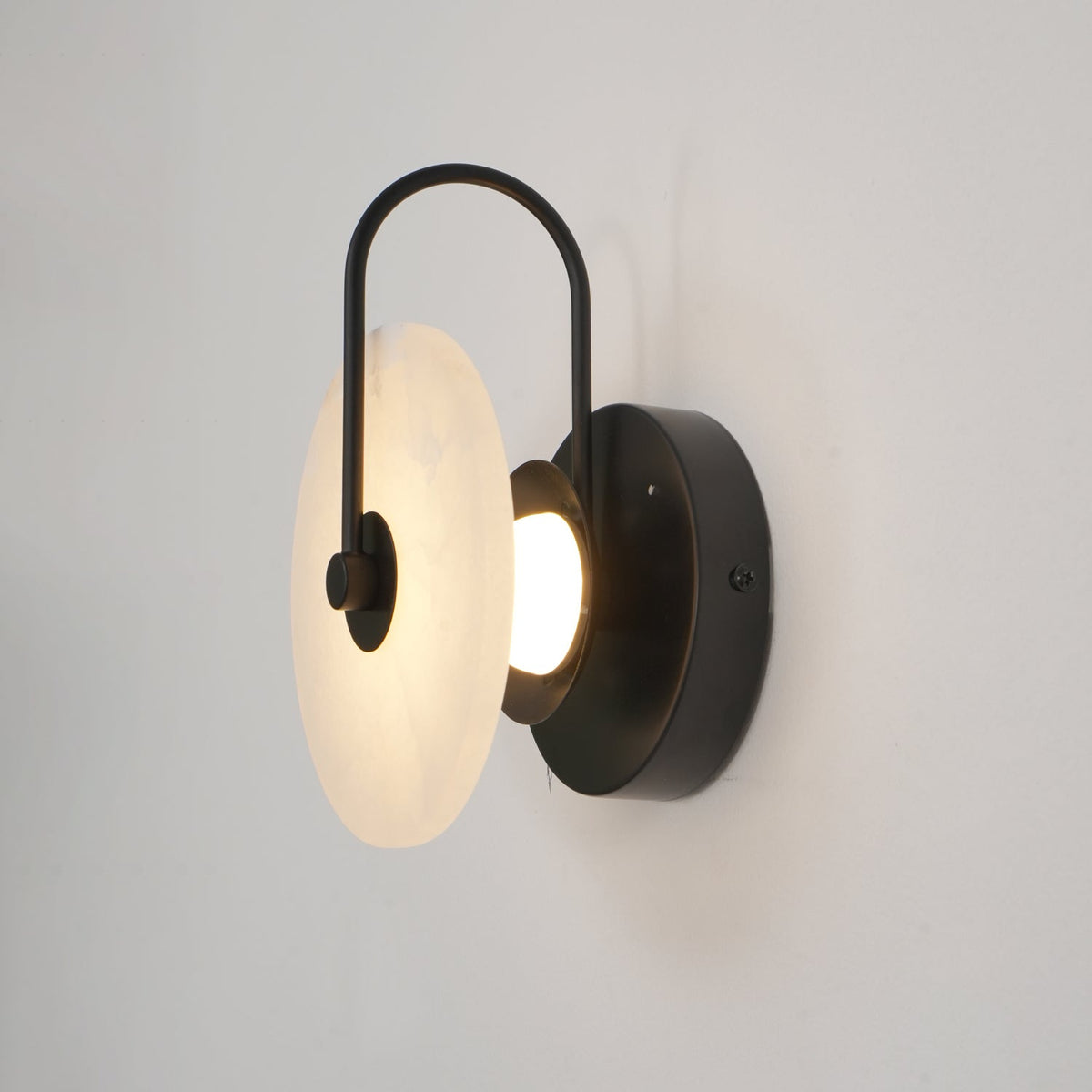 Alabaster LED Disc Wall Sconce — Warm Light, Black Arm