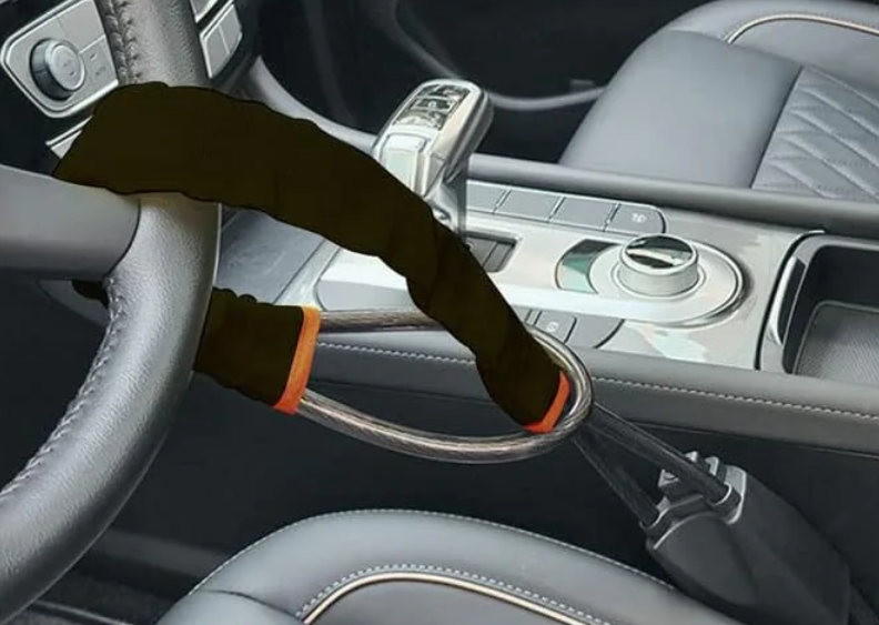 Driver Compartment Steering Restraint Lock — Seatbelt Buckle Anchor