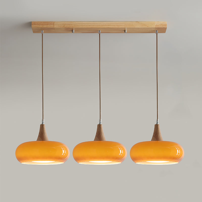 Suspension Eloria — abat-jour en verre ambré, partie supérieure en bois
