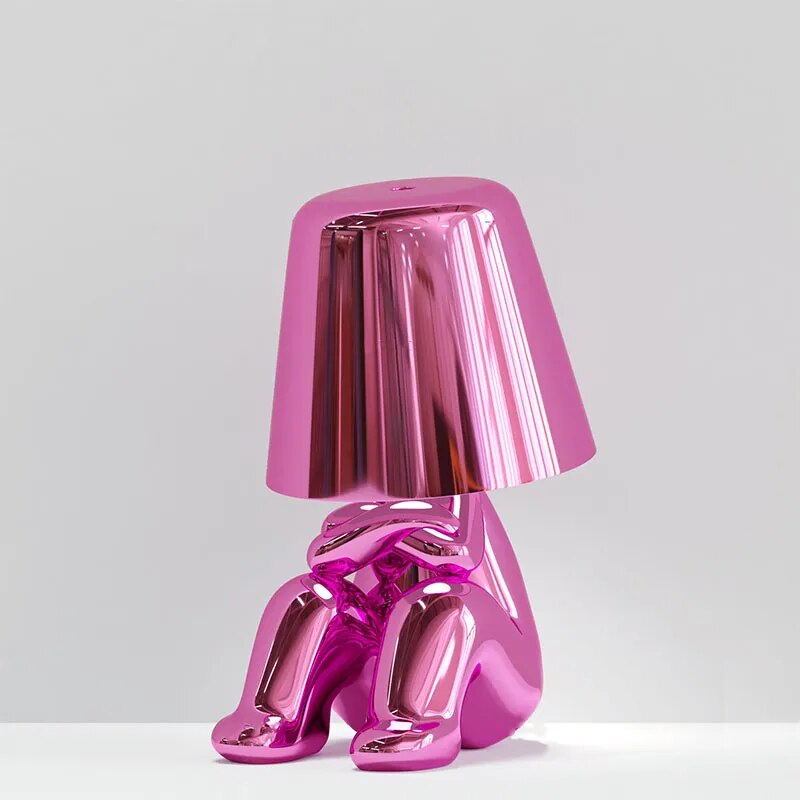 Goudje LED-Tischleuchte aus Kunstharz — skulpturales Denker-Design
