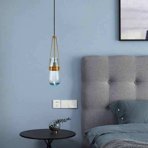 Caelara Brass-Accented Pendant Light With Sky Glass Hue