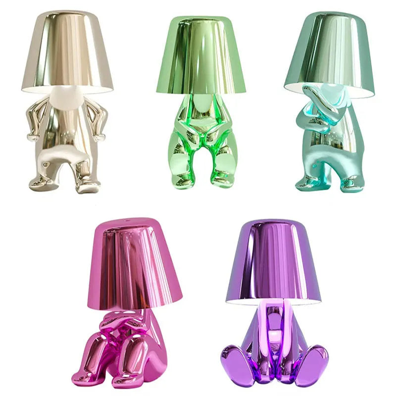 Goudje LED-Tischleuchte aus Kunstharz — skulpturales Denker-Design