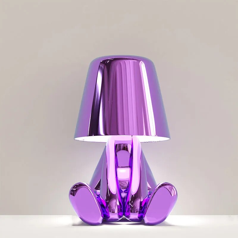 Goudje LED-Tischleuchte aus Kunstharz — skulpturales Denker-Design