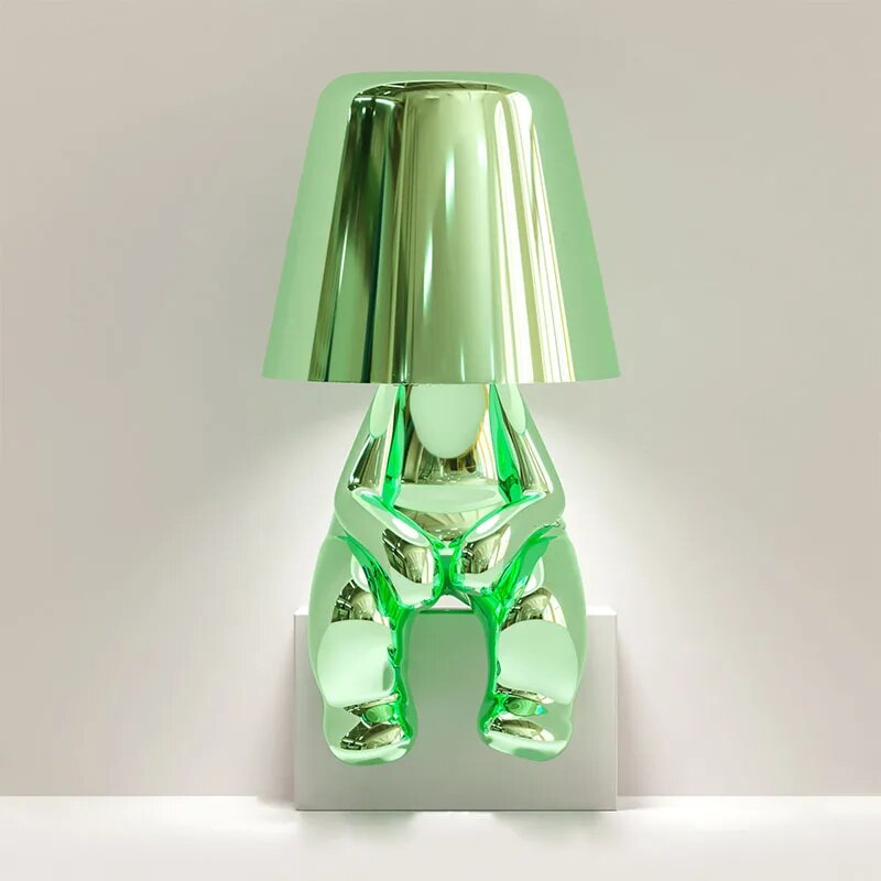 Goudje LED-Tischleuchte aus Kunstharz — skulpturales Denker-Design